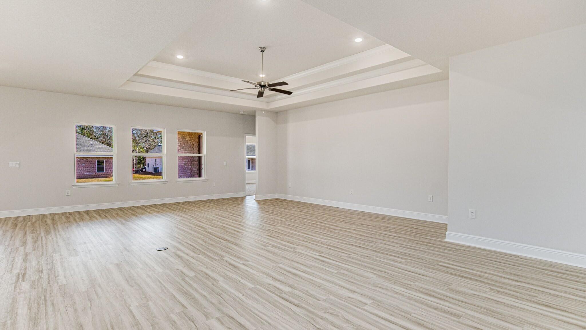 4983 Soundside Drive Gulf Breeze, FL 32563 - Photo 3 of 16 wooden floor in an empty room with a window