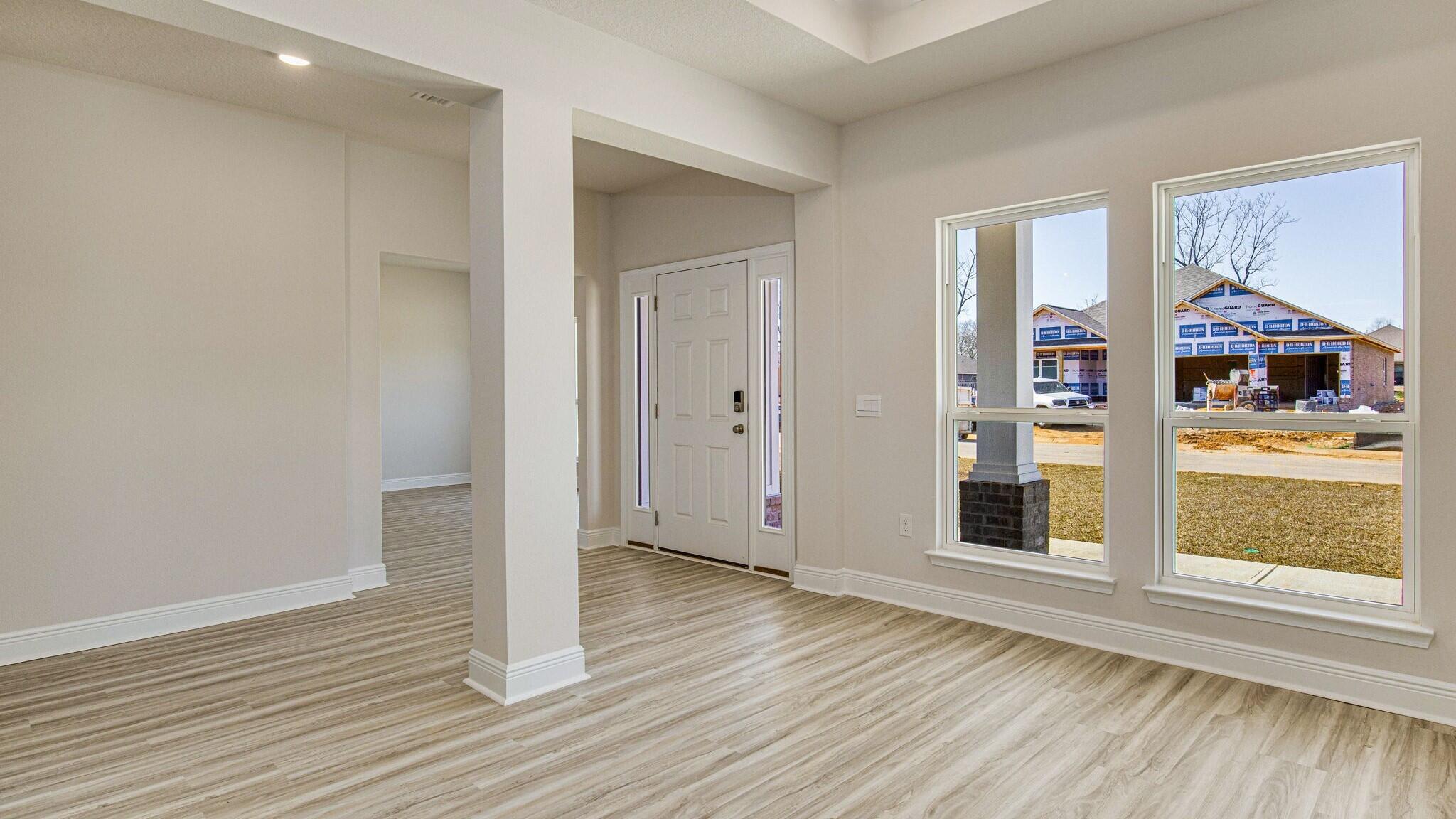 4983 Soundside Drive Gulf Breeze, FL 32563 - Photo 5 of 16 wooden floor in an empty room with a window