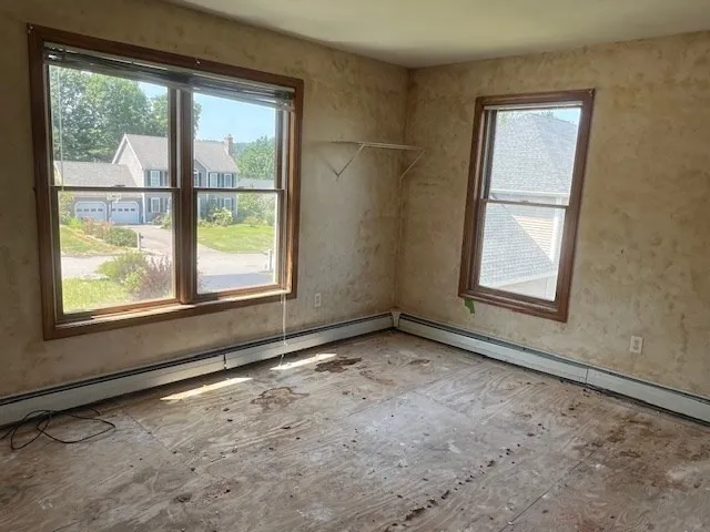 a view of an empty room with a window