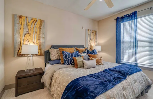 a bedroom with bed and window