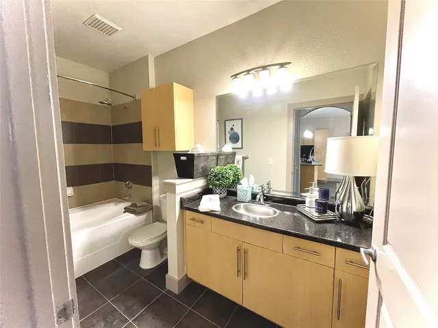 a bed room with a bed and a couch