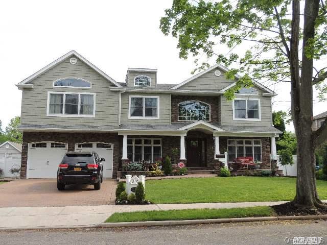 1567 Henry Road Wantagh, NY 11793 - Photo 1 of 1 a car parked in front of a house