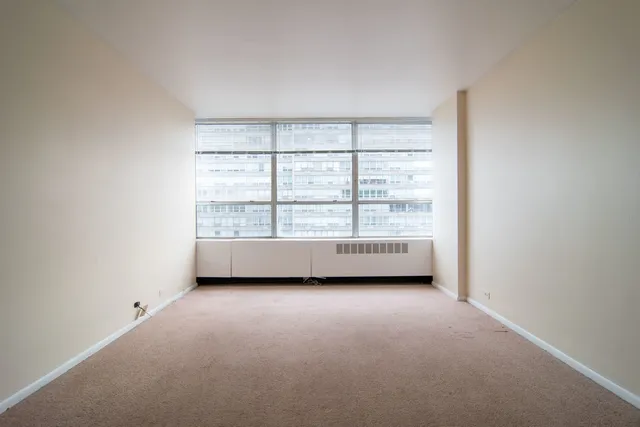 a large white room with a large window