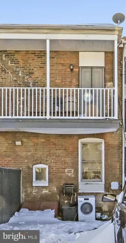 a view of a brick house with many windows