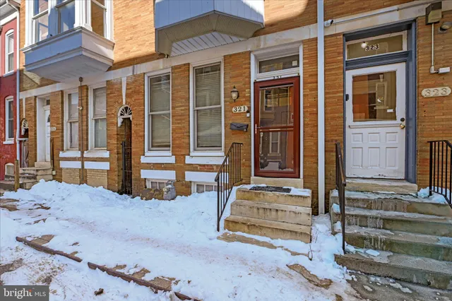 a front view of a house with a outdoor view