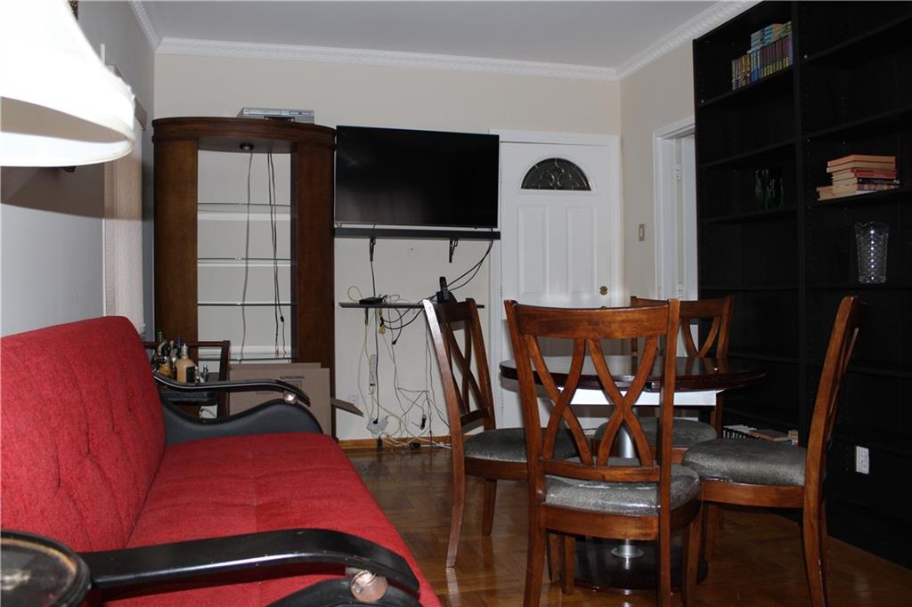 6 Brighton 10th Terrace Brooklyn, NY 11235 - Photo 2 of 8 a bedroom with furniture and natural light