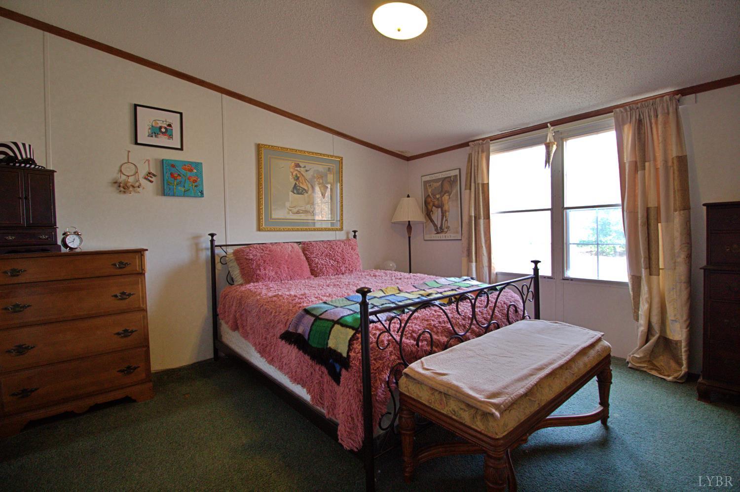 2112 Morning Star Road Appomattox, VA 24522 - Photo 12 of 24 a bedroom with a bed and a window