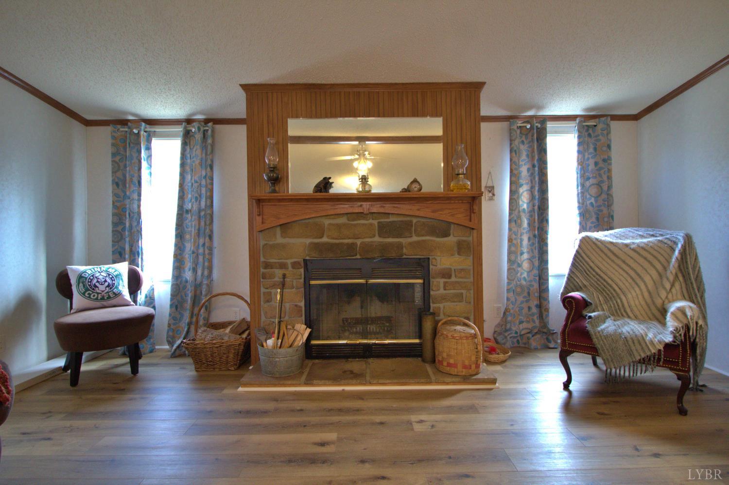 2112 Morning Star Road Appomattox, VA 24522 - Photo 12 of 24 a living room with furniture and a fireplace