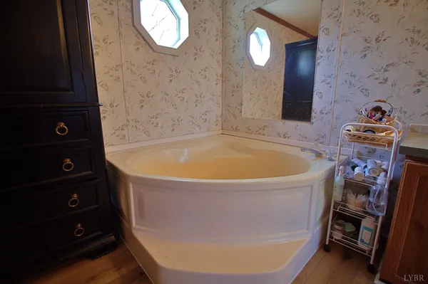 a white bath tub sitting in a bathroom