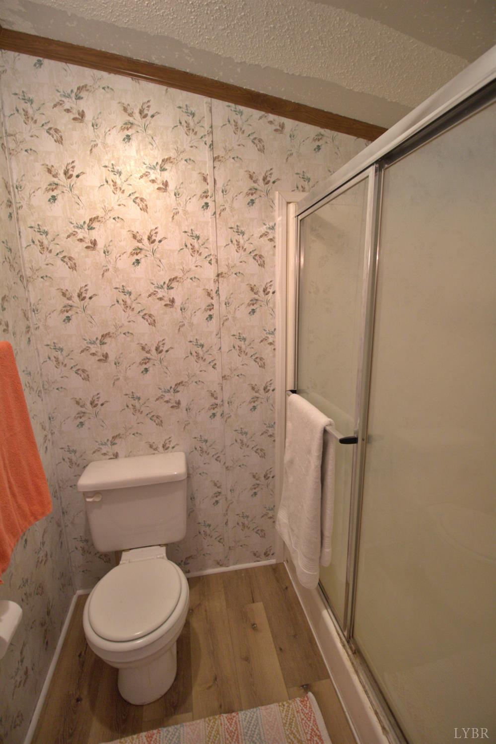 2112 Morning Star Road Appomattox, VA 24522 - Photo 18 of 24 a bathroom with a toilet and a shower