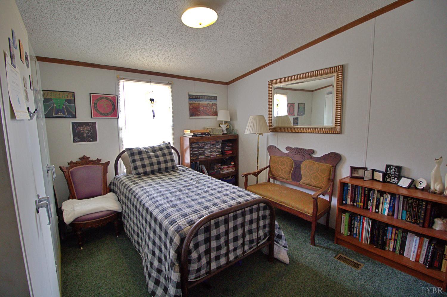 2112 Morning Star Road Appomattox, VA 24522 - Photo 20 of 24 a bedroom with a bed furniture and a book shelf