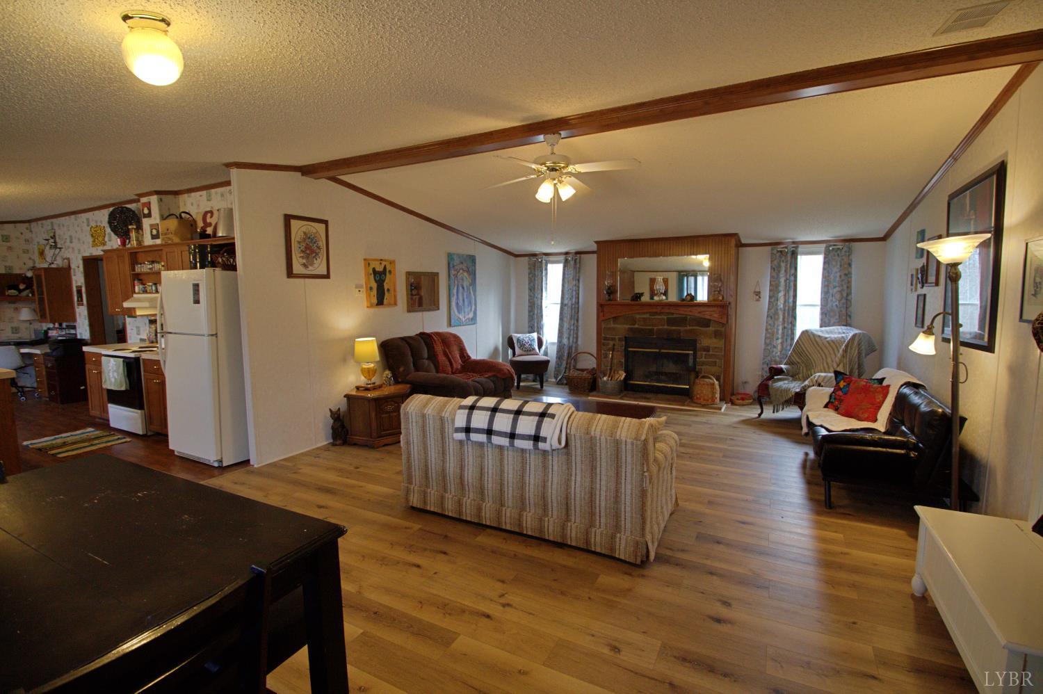 2112 Morning Star Road Appomattox, VA 24522 - Photo 6 of 24 a living room with furniture and a fireplace