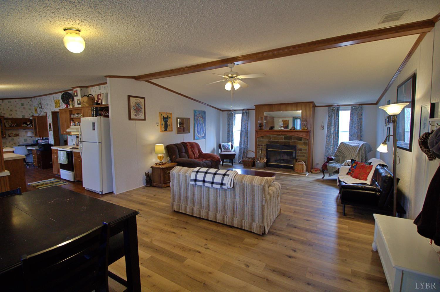 2112 Morning Star Road Appomattox, VA 24522 - Photo 9 of 24 a living room with fireplace furniture and a wooden floor