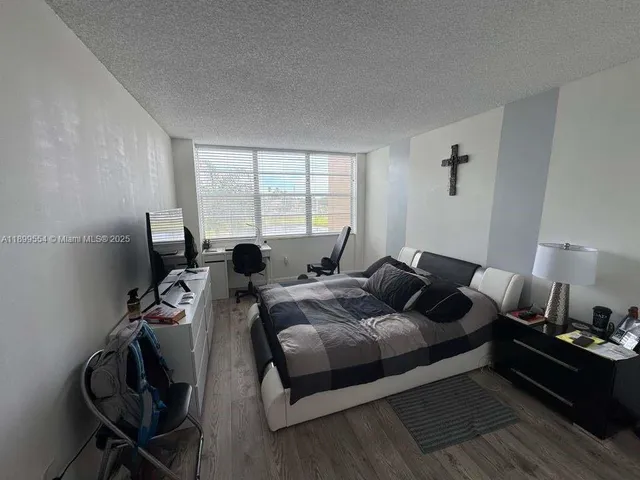 a bed room with two bed and a couch