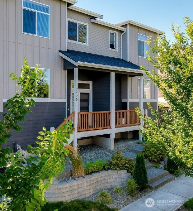 2425 Schley Boulevard Bremerton, WA 98310 - Photo 23 of 23 a view of a house with potted plants and a porch