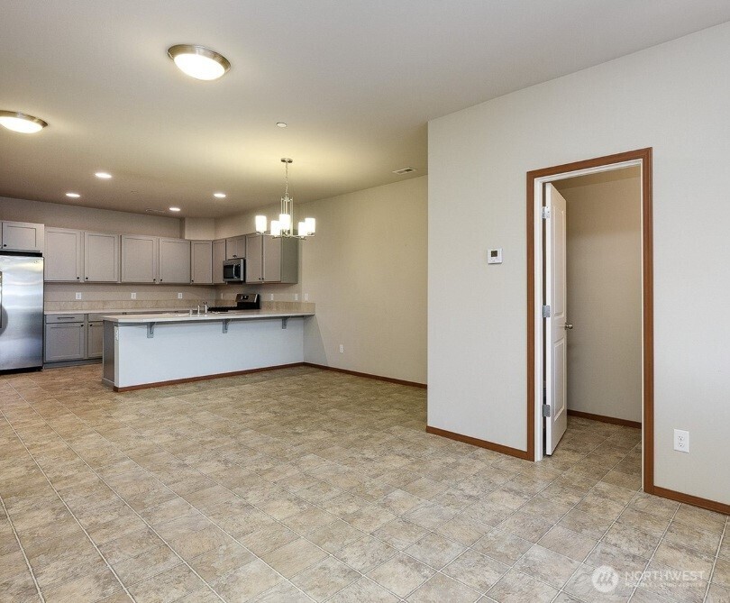 2425 Schley Boulevard Bremerton, WA 98310 - Photo 7 of 23 a view of kitchen with kitchen island and stainless steel appliances