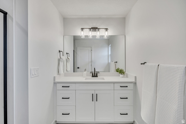330 East 7635 S Street Sandy, UT 84047 - Photo 14 of 29 Bathroom with vanity and baseboards