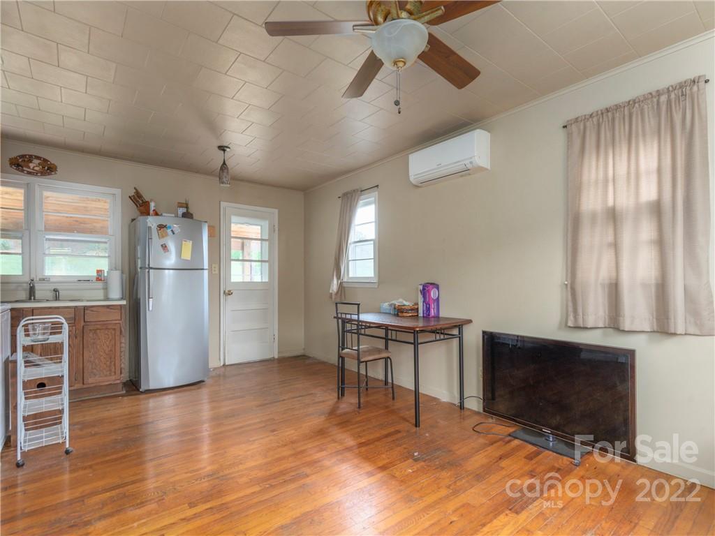 155 Substation Road Canton, NC 28716 - Photo 23 of 28 a living room with furniture and a flat screen tv