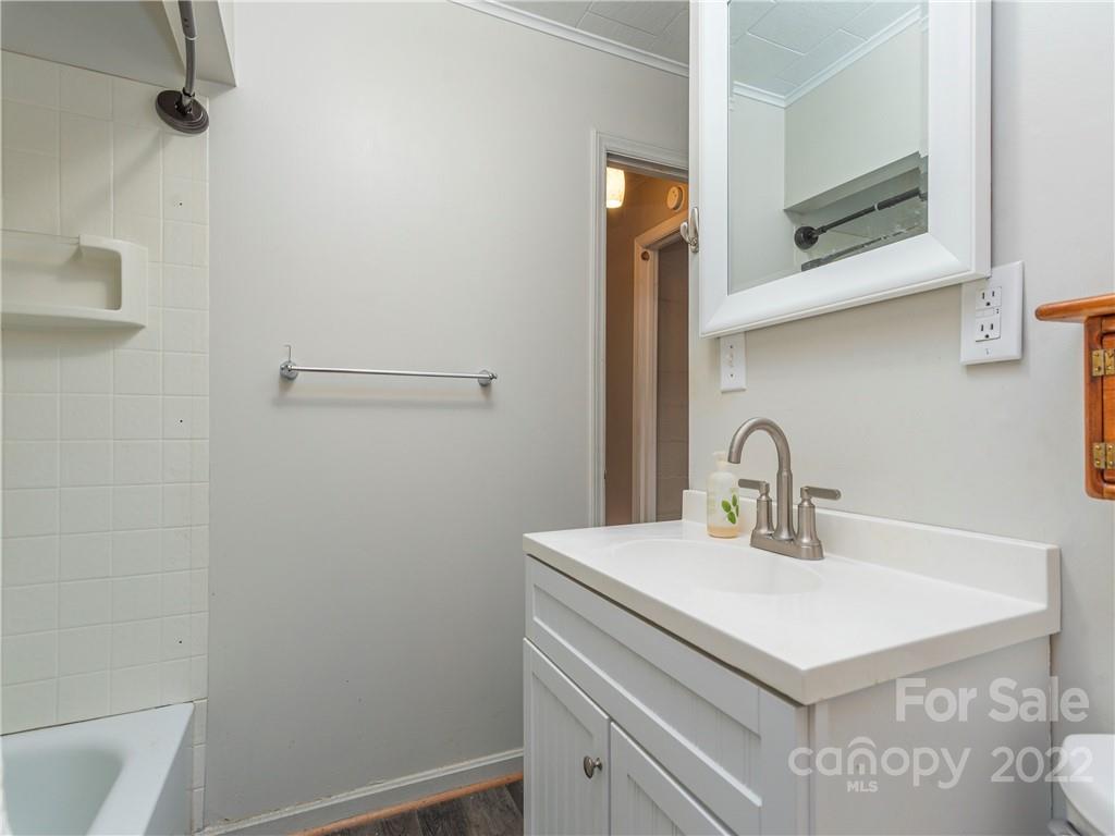 155 Substation Road Canton, NC 28716 - Photo 28 of 28 a bathroom with a sink and vanity