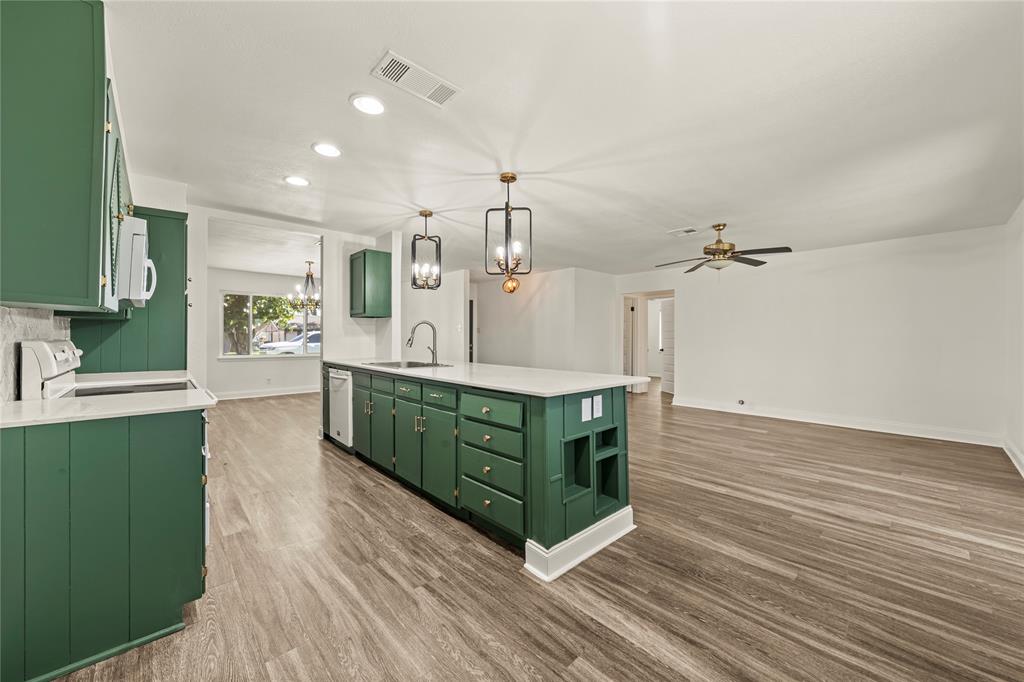 104 East Santa Anna Street Robinson, TX 76706 - Photo 14 of 36 a kitchen with stainless steel appliances granite countertop a sink and cabinets