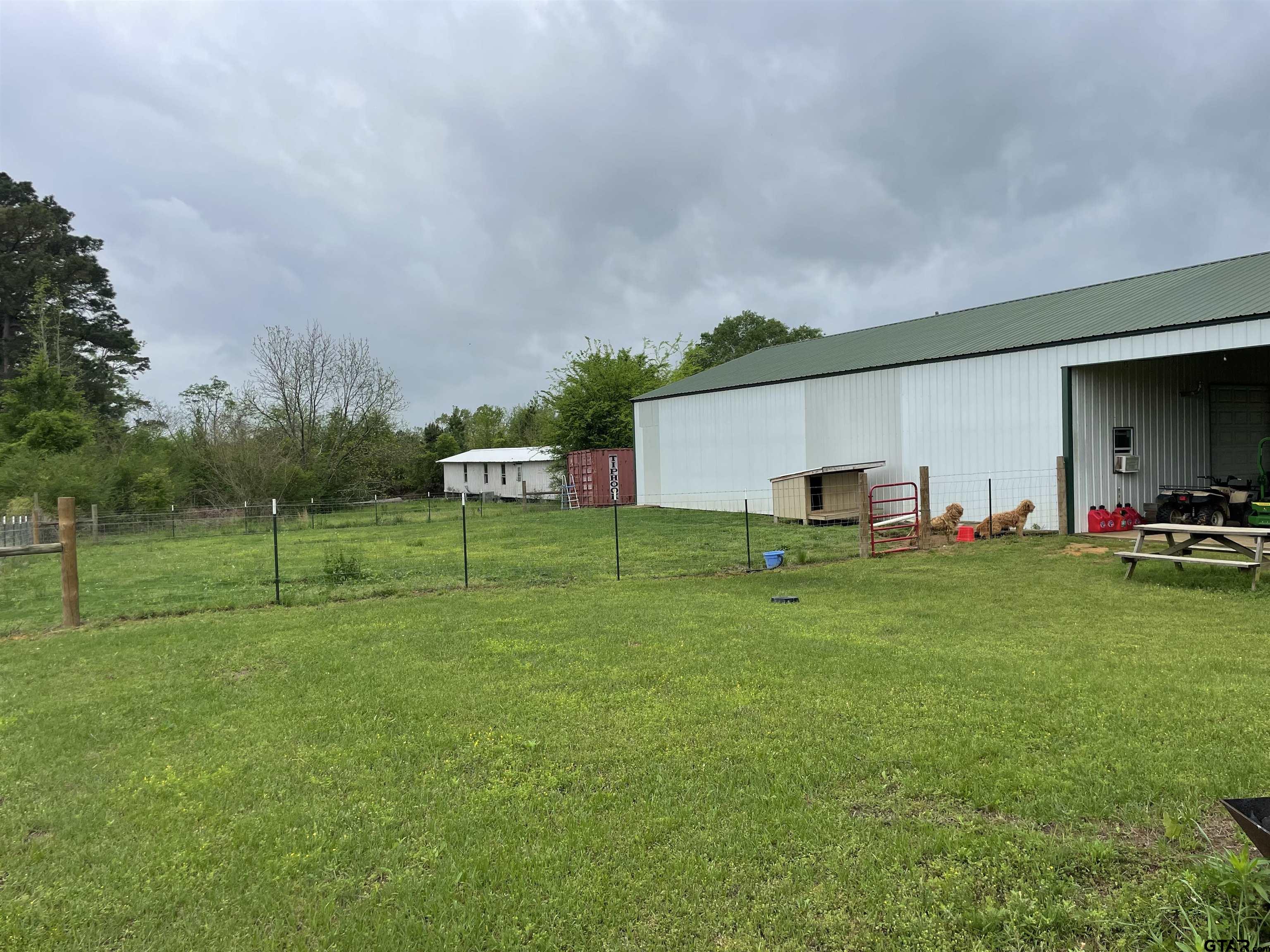 677 South Chandler Street Rusk, TX 75785 - Photo 15 of 16 a backyard of a house with table and chairs