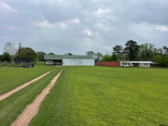 a view of a garden with houses