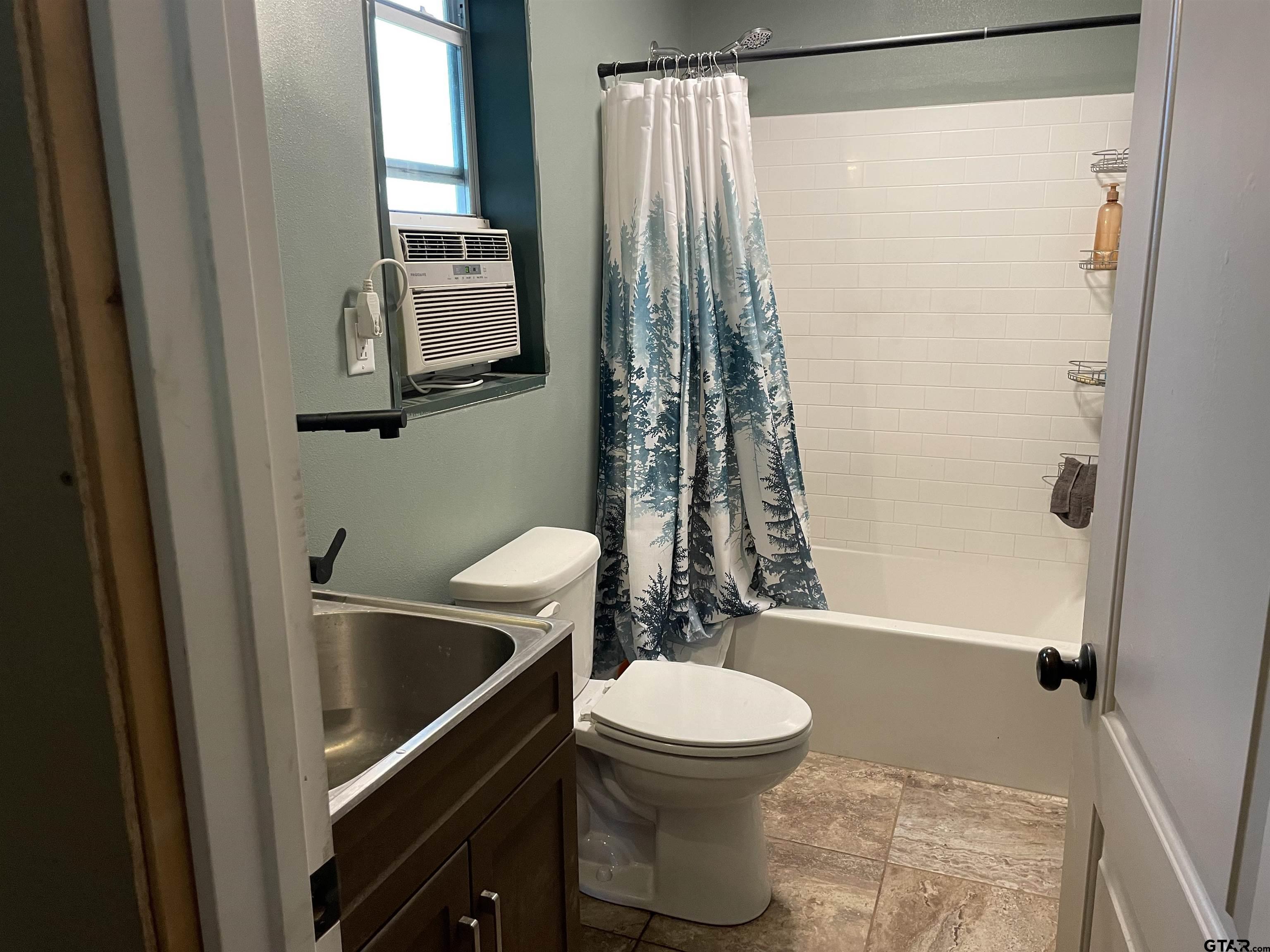 677 South Chandler Street Rusk, TX 75785 - Photo 5 of 16 a bathroom with a toilet and a shower