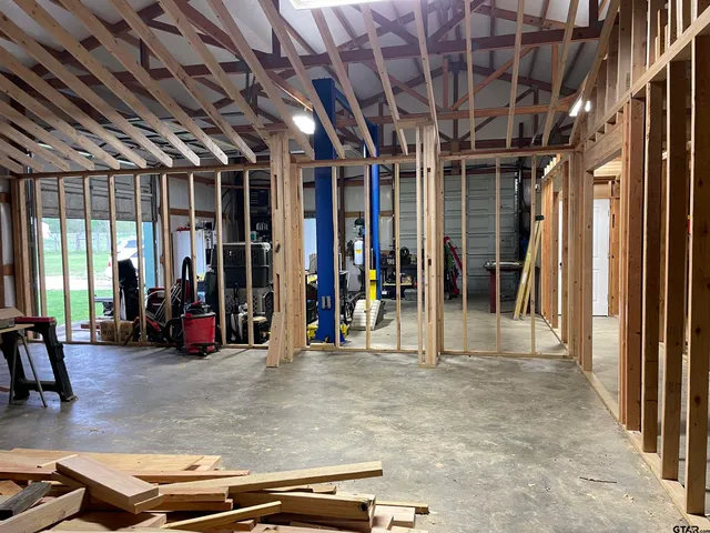 a view of a room with wooden roof and glass windows
