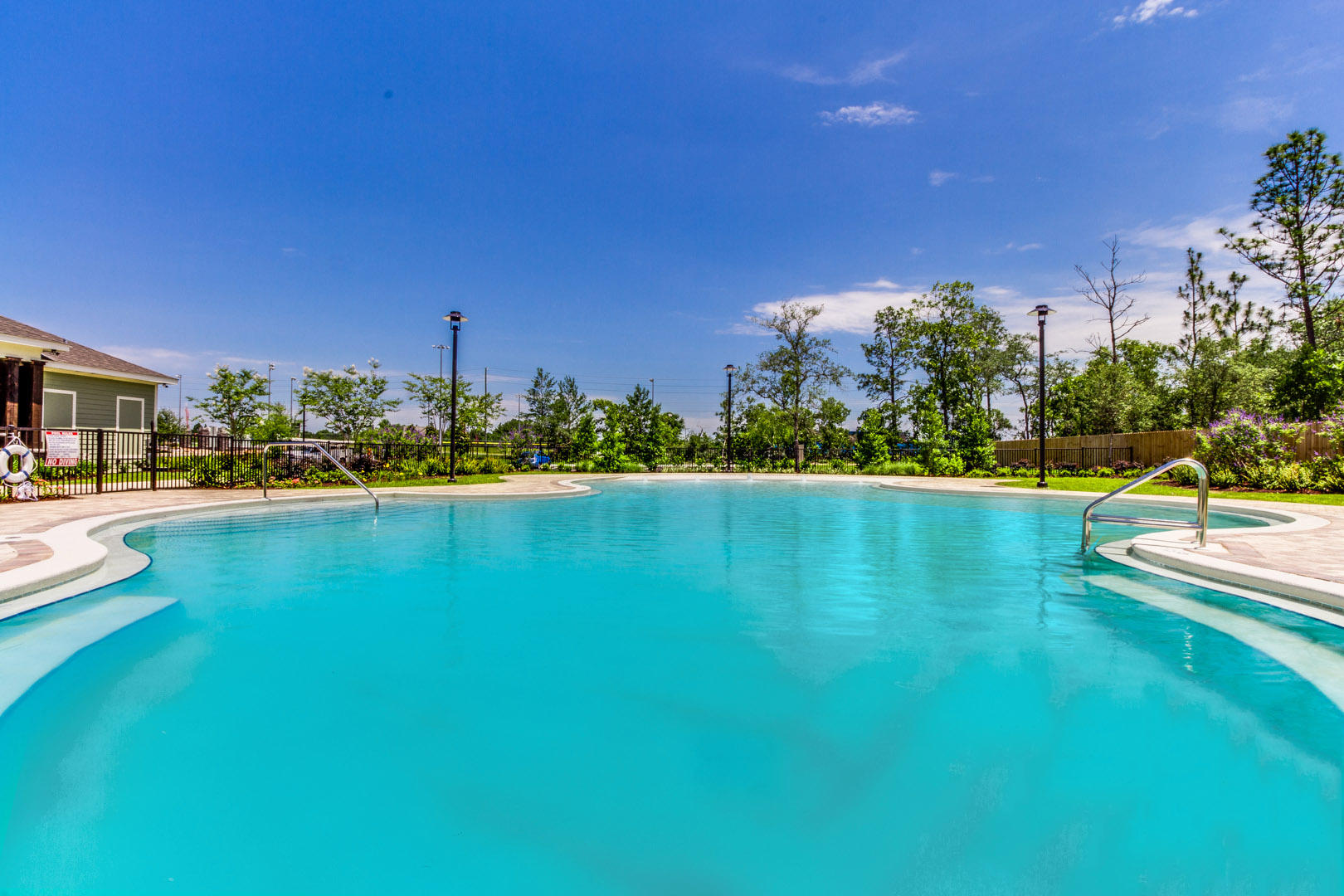 814 Moorhen Way Crestview, FL 32539 - Photo 7 of 8 a view of a swimming pool with an outdoor space and seating area