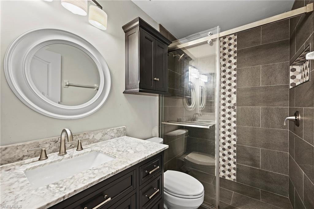 21684 Brixham Run Loop Estero, FL 33928 - Photo 19 of 26 Bathroom with vanity and a shower stall