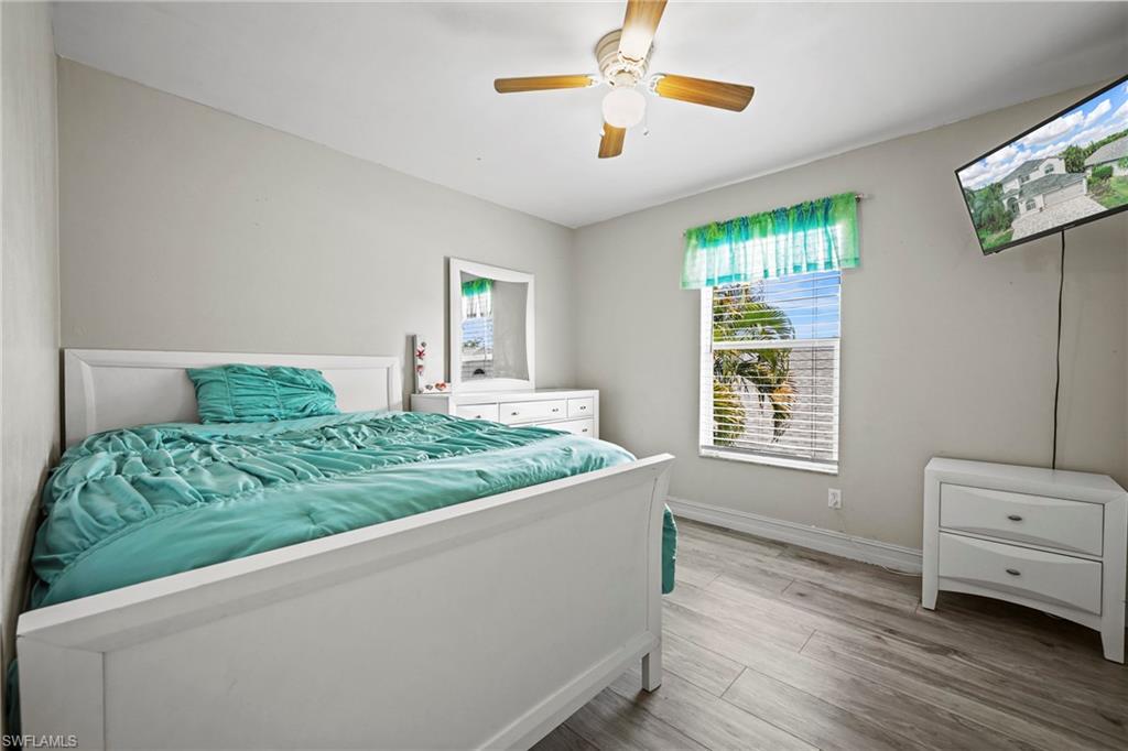 21684 Brixham Run Loop Estero, FL 33928 - Photo 20 of 26 Bedroom featuring wood finished floors and ceiling fan