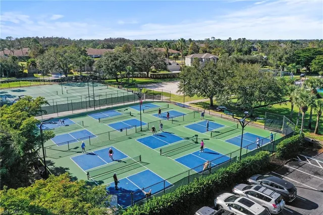 an aerial view of residential houses with outdoor space and street view