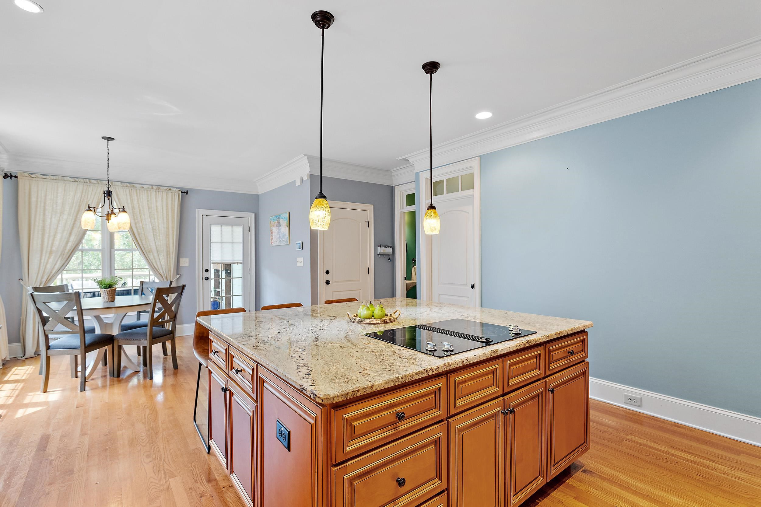 1312 Ileagnes Road Raleigh, NC 27603 - Photo 13 of 34 a kitchen that has a table chairs and wooden floor