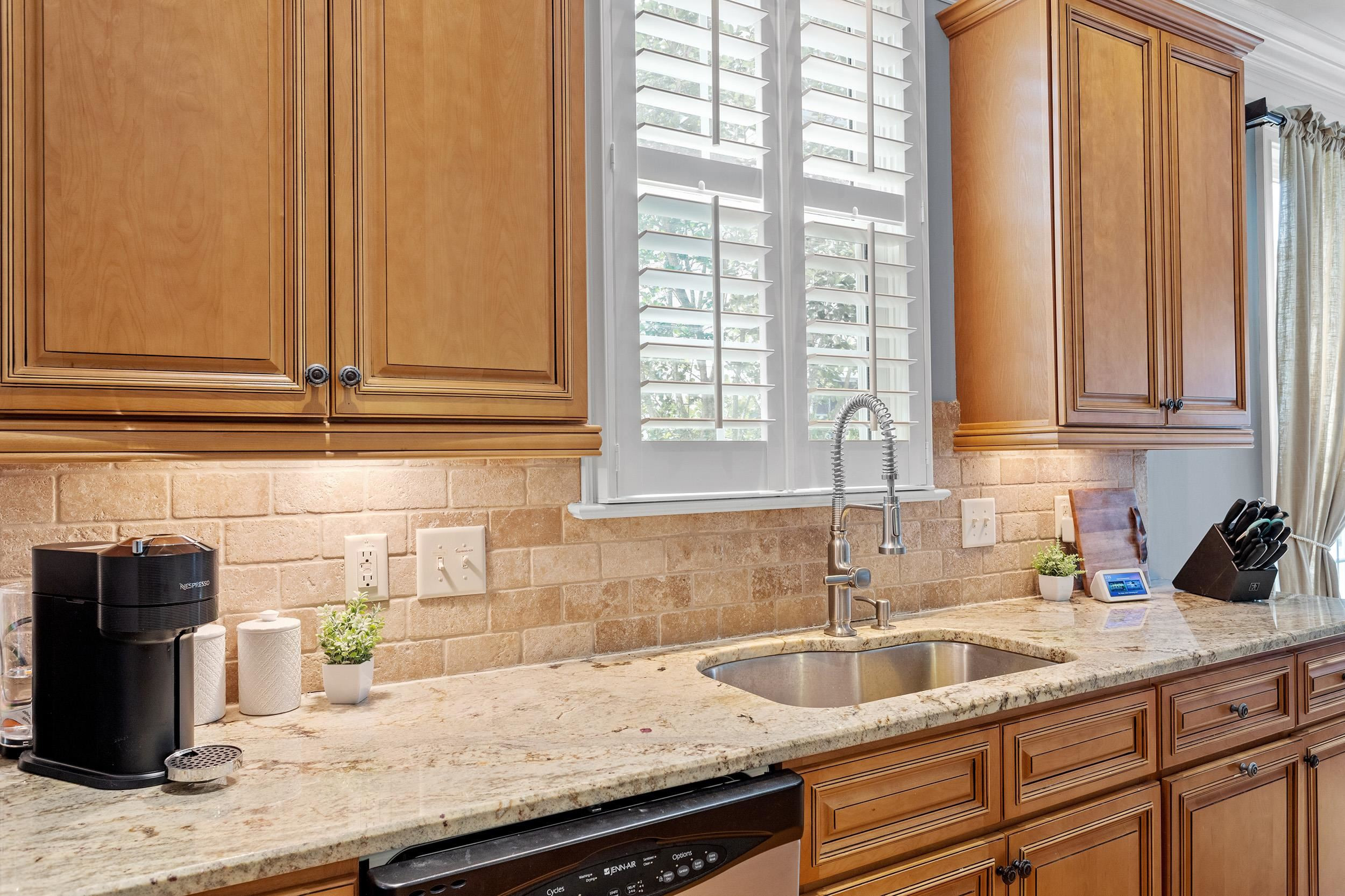 1312 Ileagnes Road Raleigh, NC 27603 - Photo 15 of 34 a kitchen with granite countertop a sink and a window