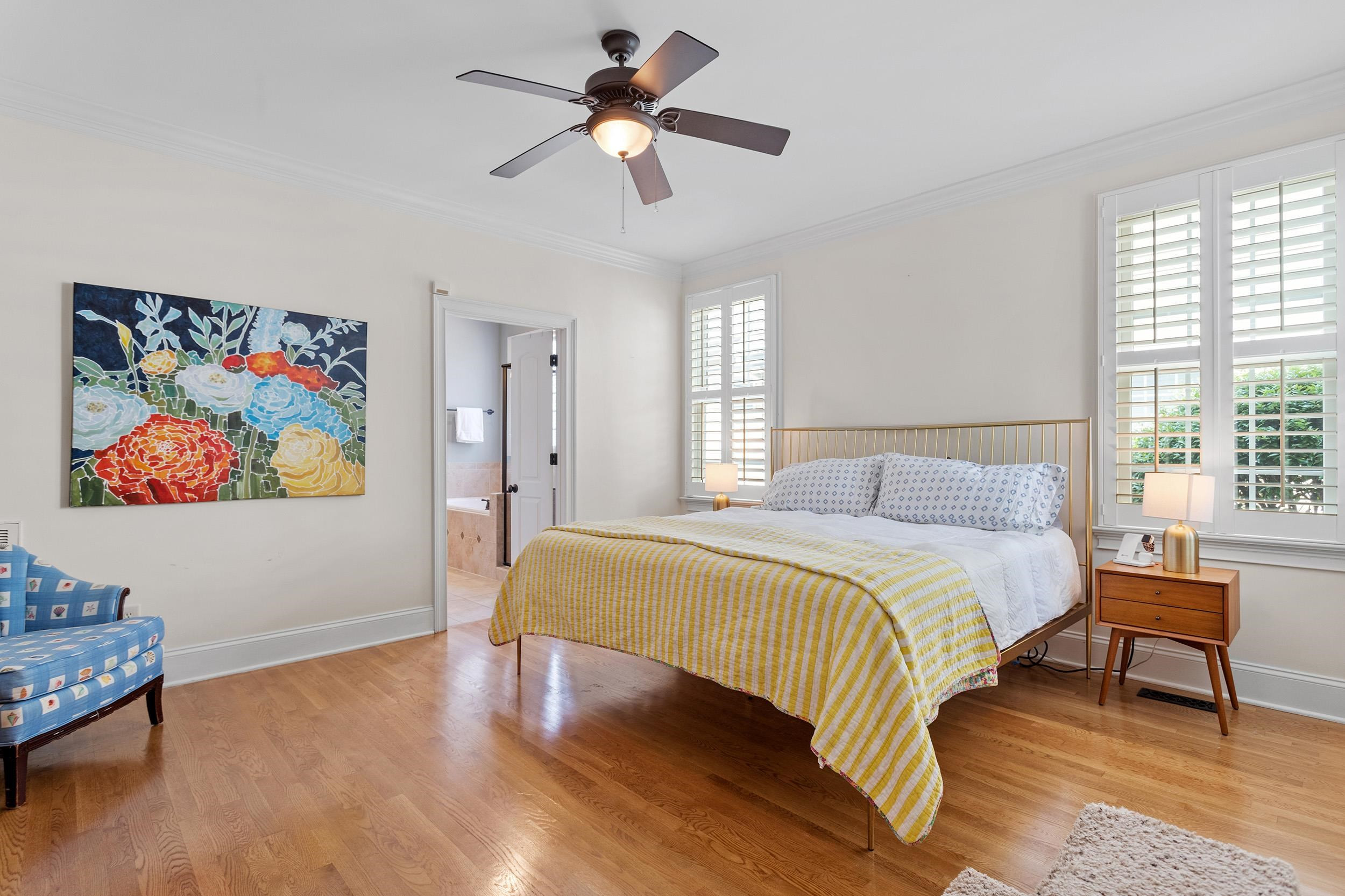 1312 Ileagnes Road Raleigh, NC 27603 - Photo 16 of 34 a bedroom with a bed and a painting on the wall