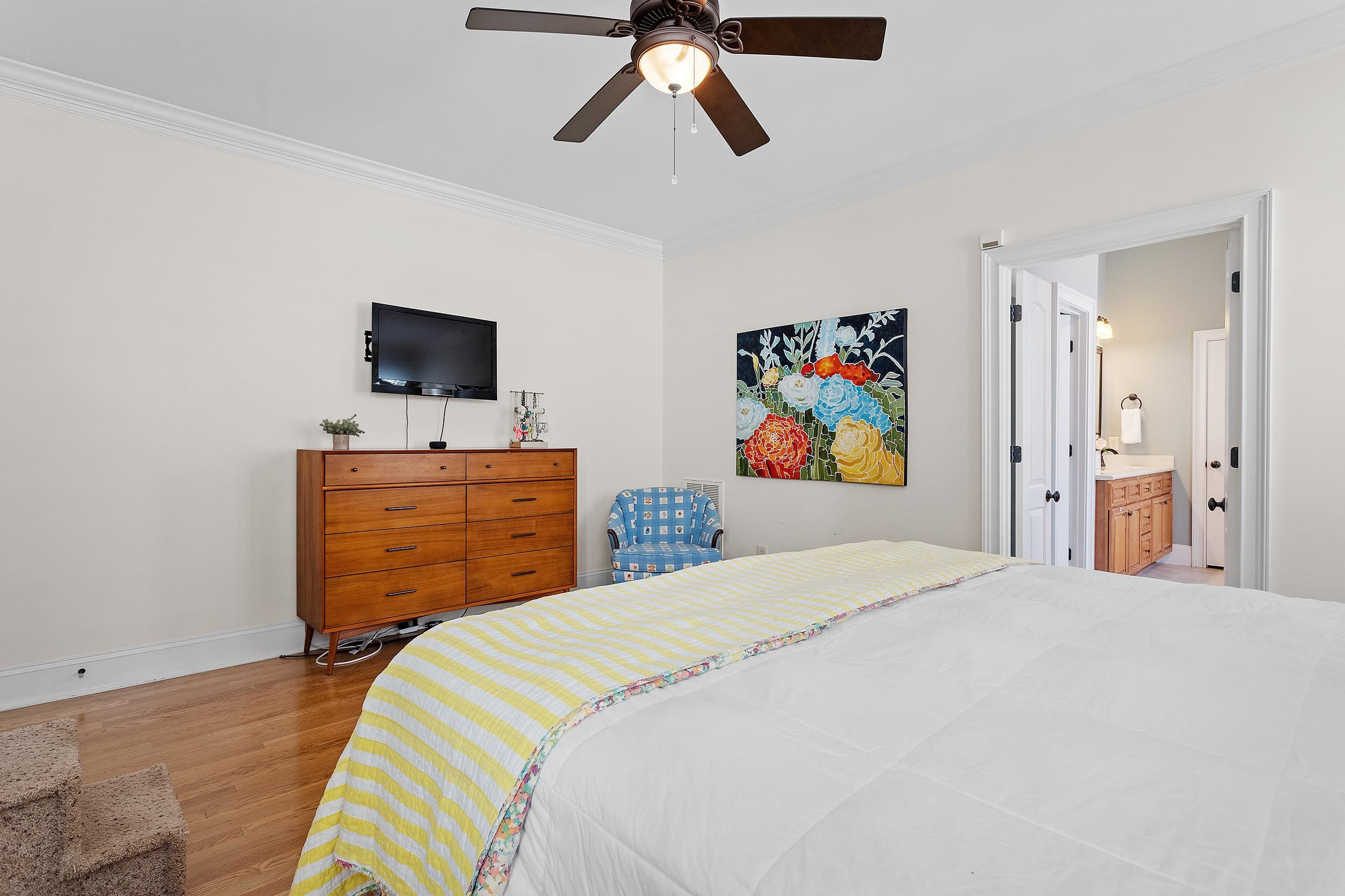 1312 Ileagnes Road Raleigh, NC 27603 - Photo 17 of 34 a bedroom with a bed and painting on the wall