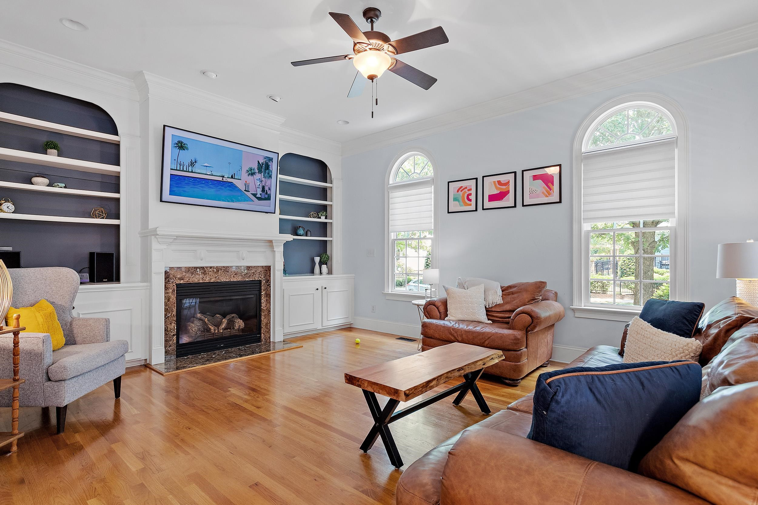1312 Ileagnes Road Raleigh, NC 27603 - Photo 6 of 34 a living room with furniture a window and a fireplace