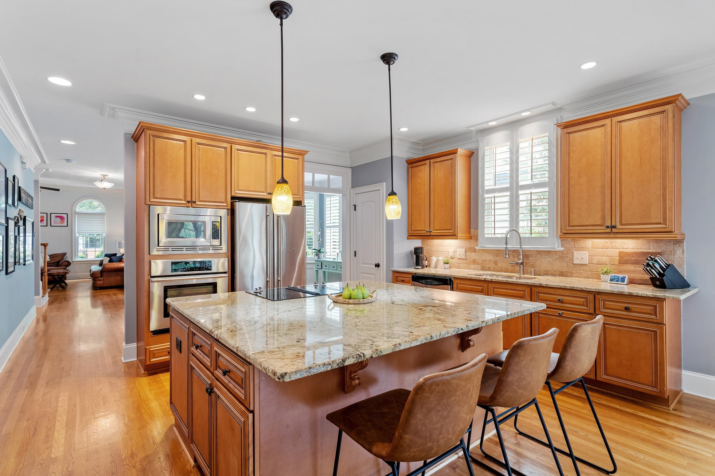 1312 Ileagnes Road Raleigh, NC 27603 - Photo 10 of 34 a kitchen with stainless steel appliances granite countertop a kitchen island a stove and a sink