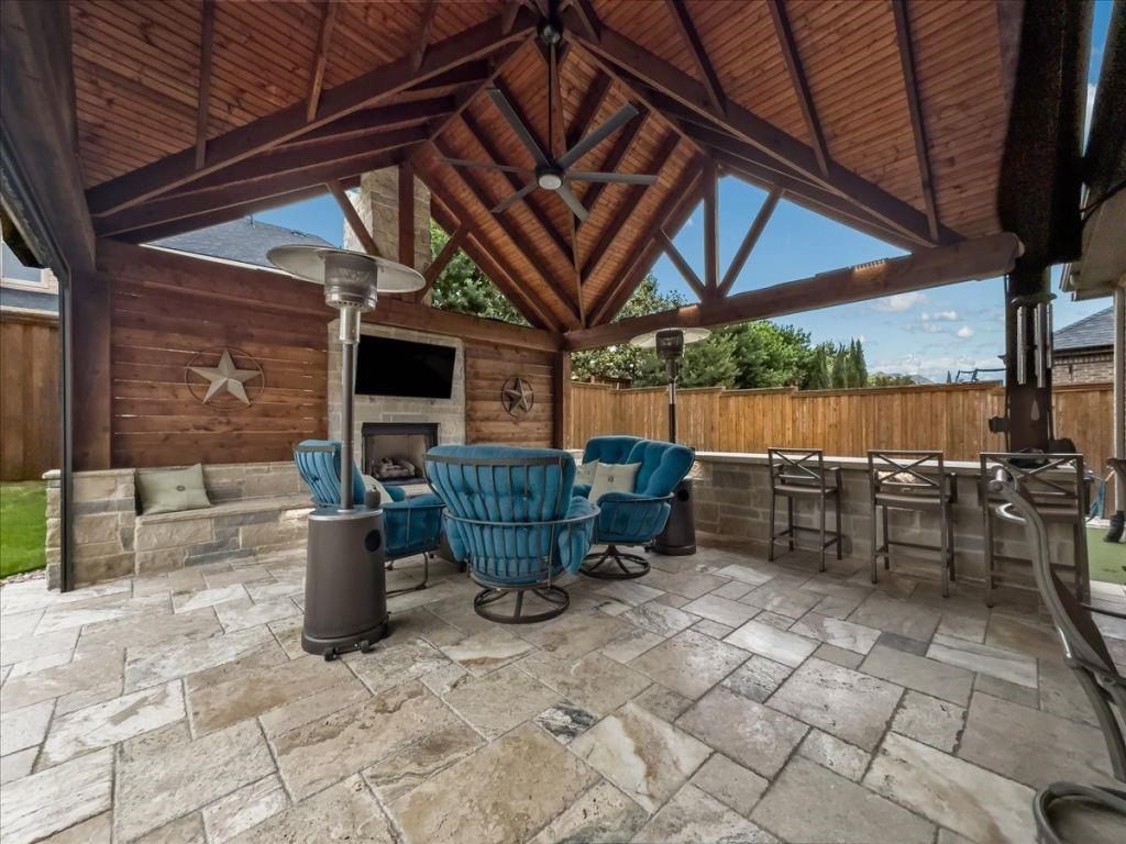 2832 Mona Vale Road Trophy Club, TX 76262 - Photo 13 of 37 a view of a patio with table and chairs and potted plants