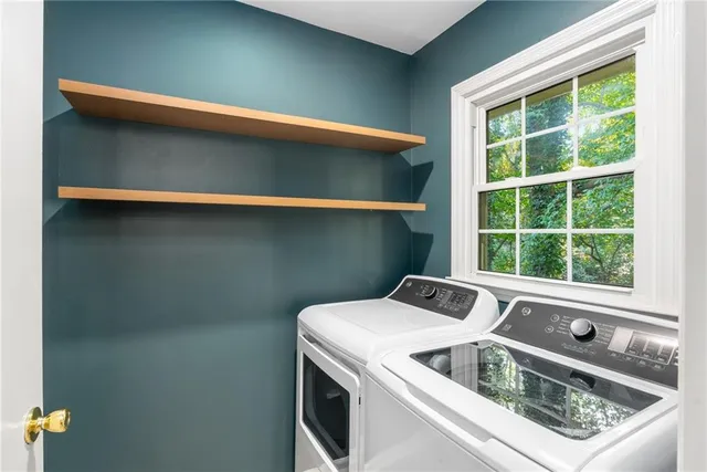 a utility room with dryer and washer