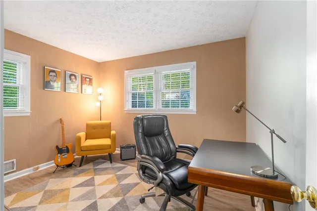 a work room with furniture and a window