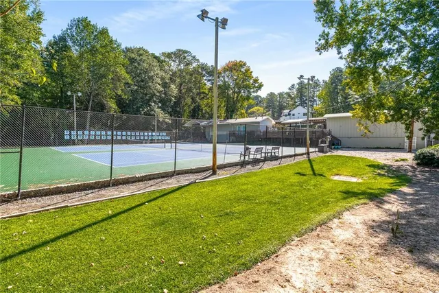 a view of a backyard with swimming pool