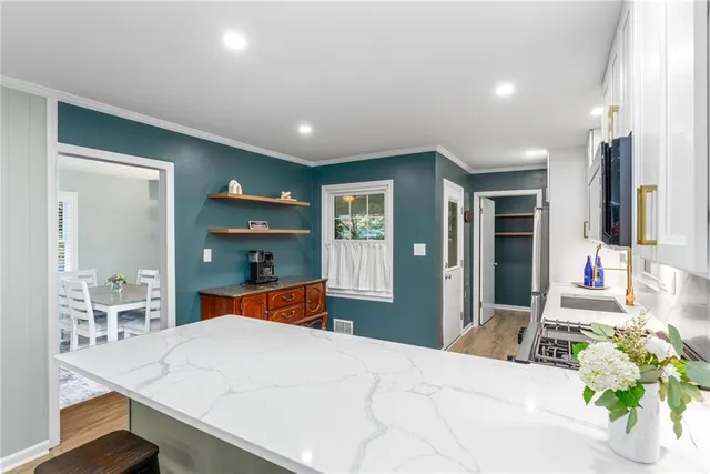 a bedroom with a bed and a large mirror