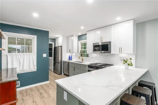 a kitchen with a table and chairs in it