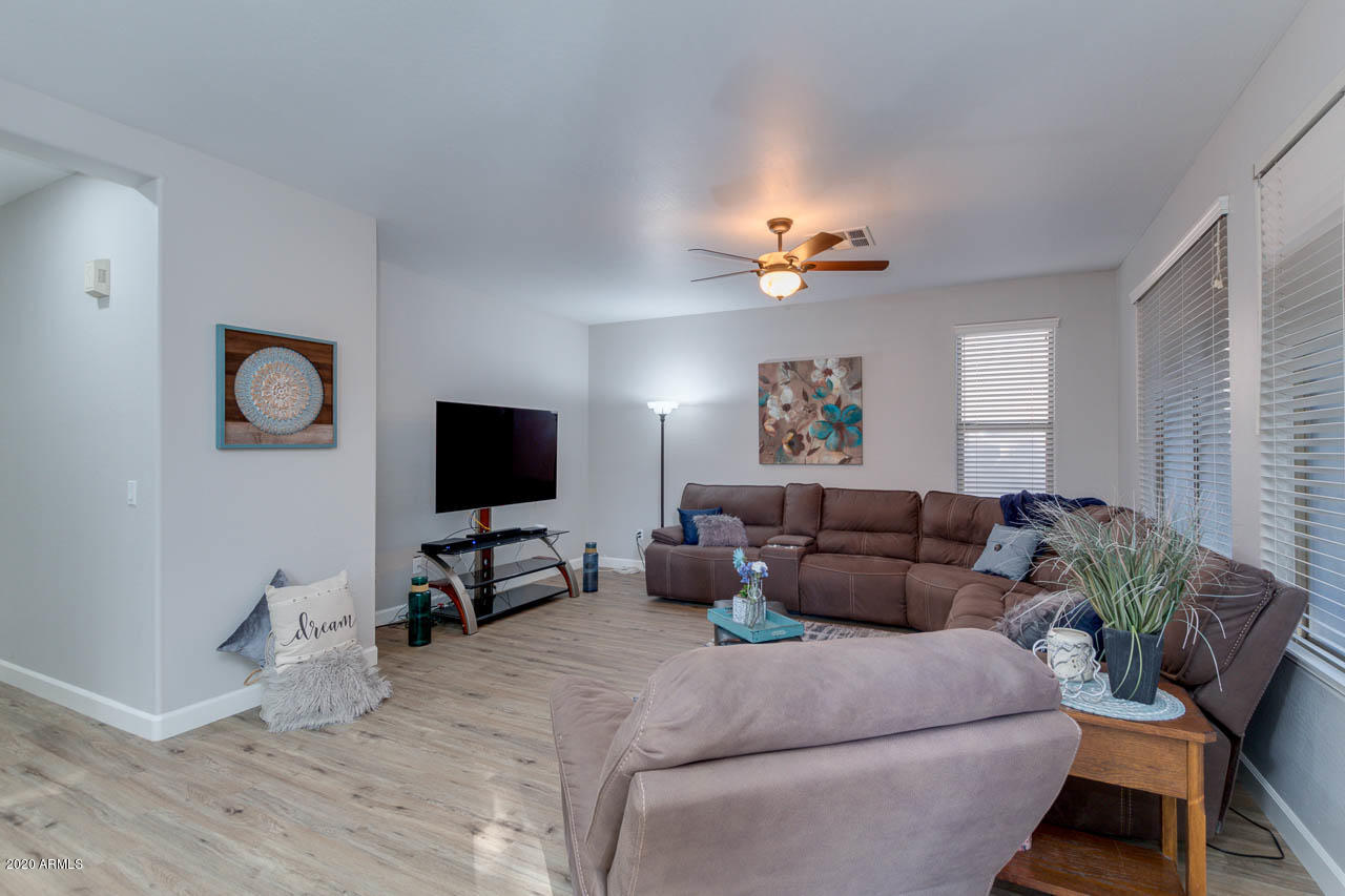 3315 East Los Altos Road Gilbert, AZ 85297 - Photo 15 of 66 a living room with furniture and a flat screen tv