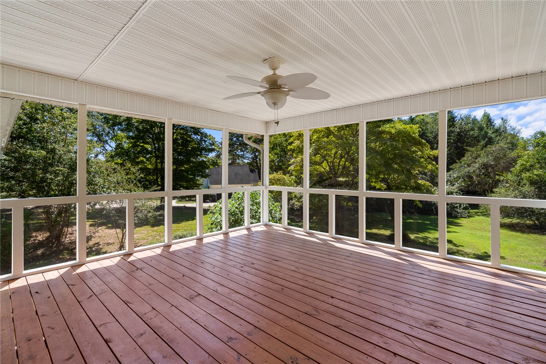 208 Williamsburg Road Anderson, SC 29621 - Photo 43 of 48 A spacious screened porch overlooks a lush green yard surrounded by mature trees.