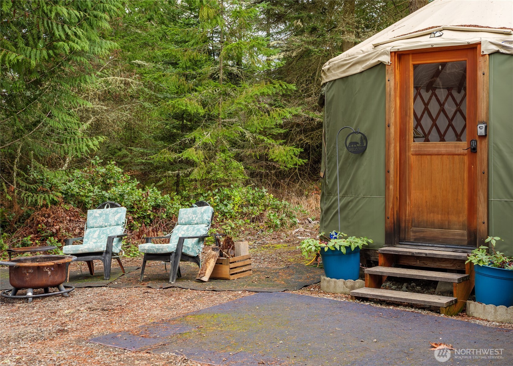 193 Springwater Lane Sequim, WA 98382 - Photo 12 of 40 a backyard of a house with outdoor seating