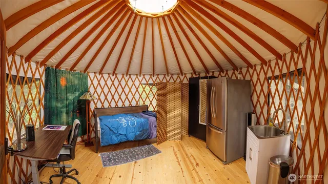 a bedroom with a bed and a chandelier