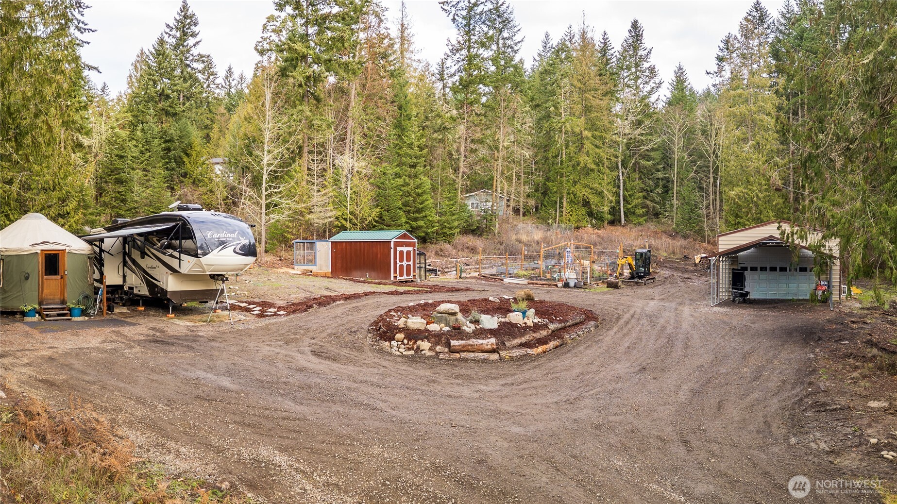 193 Springwater Lane Sequim, WA 98382 - Photo 2 of 40 a roof deck with table and chairs and a barbeque
