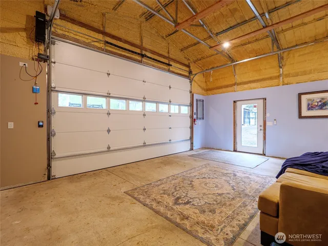 a backyard of a house with lots of trees